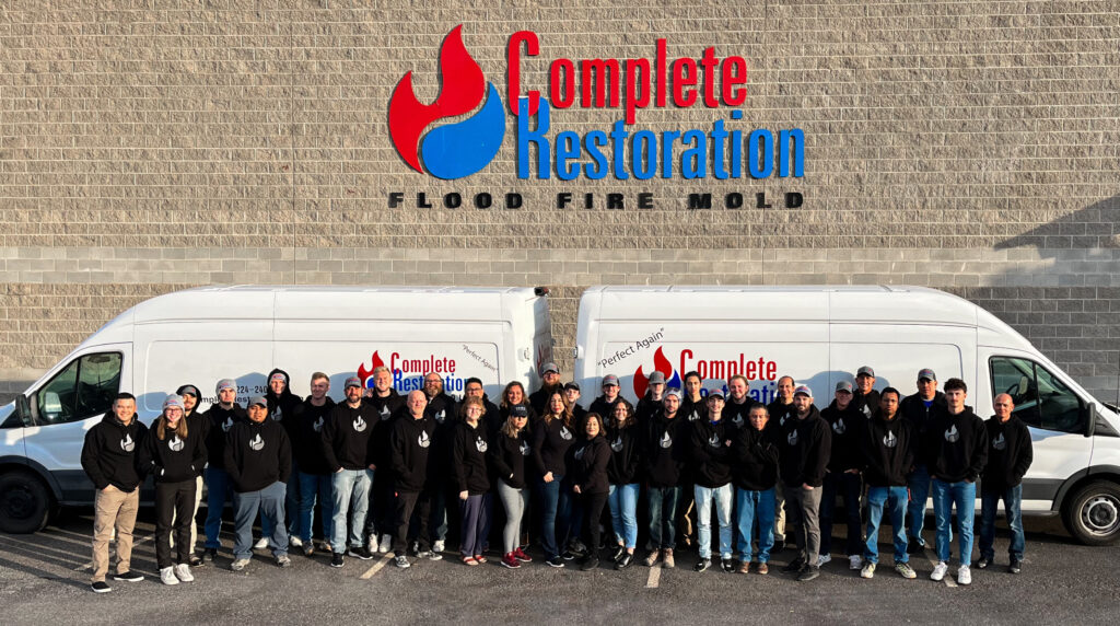 Complete Restoration company in a company photo.